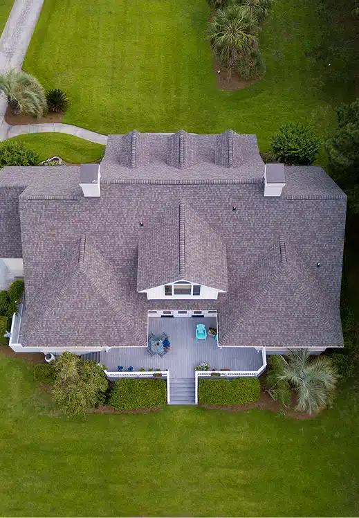 aerial-view-of-large-home-with-new-roof-on-beautif-2024-12-06-12-24-17-utc 1